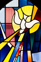 stained glass window of a dove 