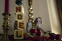 candle sticks, Noel, blocks, rocking horse, mantle, Christmas, decorations 