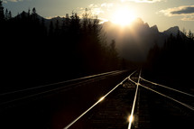 intense sunlight over railroad tracks 