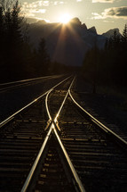 sunset over railroad tracks 