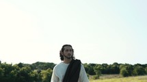 Jesus standing outdoors 