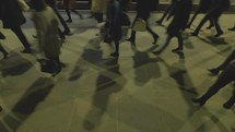 pedestrians walking on a busy city sidewalk 