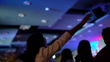 raised arms during a worship service 
