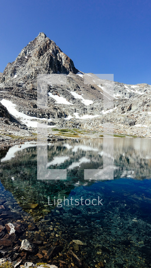 jagged mountain peaks and pond 