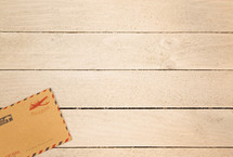 envelope on a wood background 