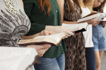 torsos of young women at a Bible study 