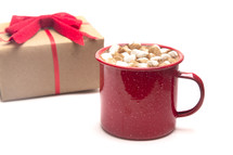 gift and mug of hot cocoa 