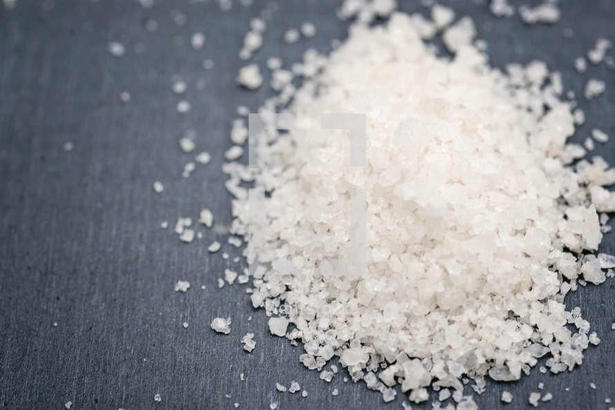 grains of salt on gray background 