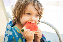 toddler girl eating watermelon 