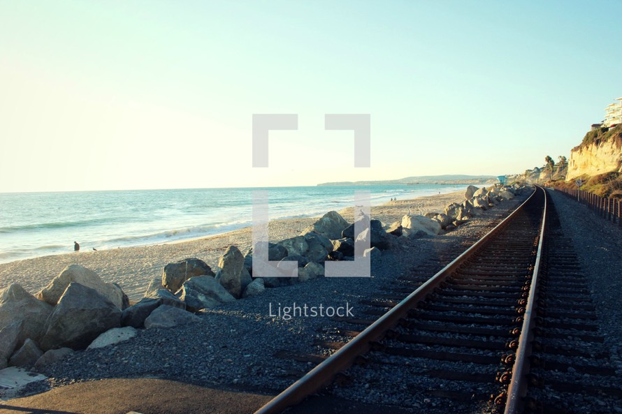train tracks on a beach 