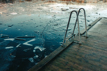 ladder on a dock on a frozen lake