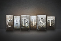 Stone tiles spelling the word CHRIST.
