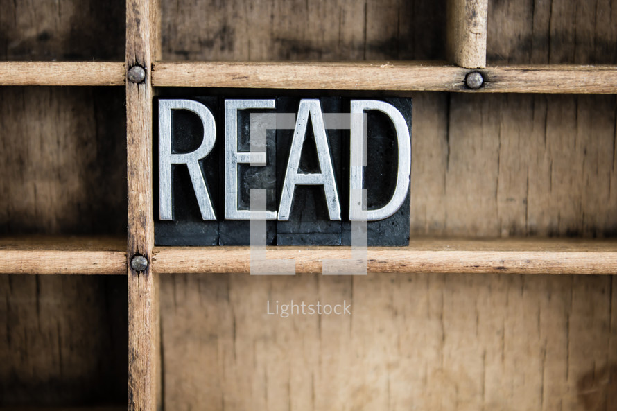 word read in blocks on a bookshelf 