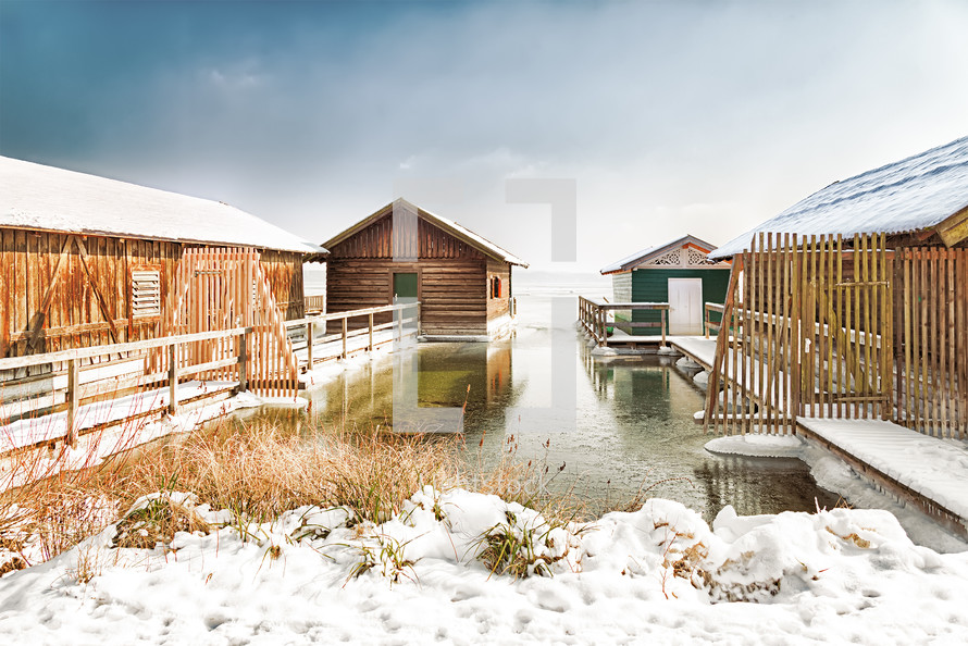 boat houses and docks in snow 
