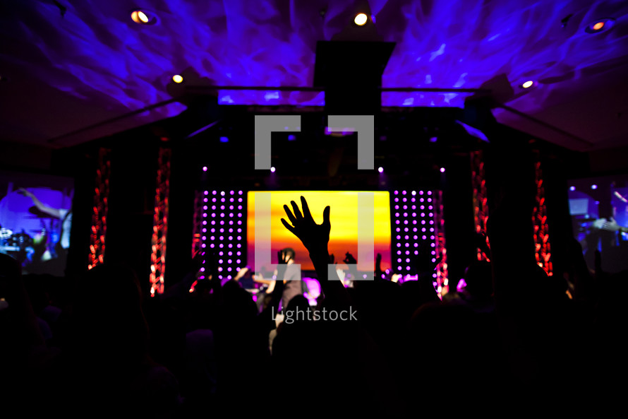 Church service worshipping hands raised lifted