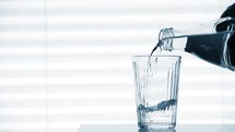 filling a glass with water 