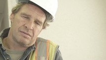 exhausted construction worker 