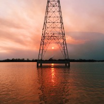tower in a lake at sunset 