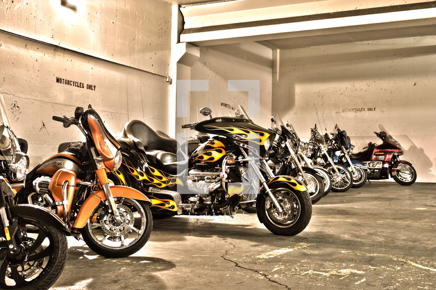 parked group of motorcycles lined up