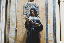 Mary holding a crucifix 