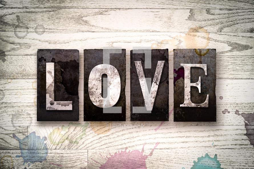 word love on wood background 