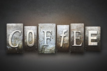 Stone tiles spelling the word COFFEE.