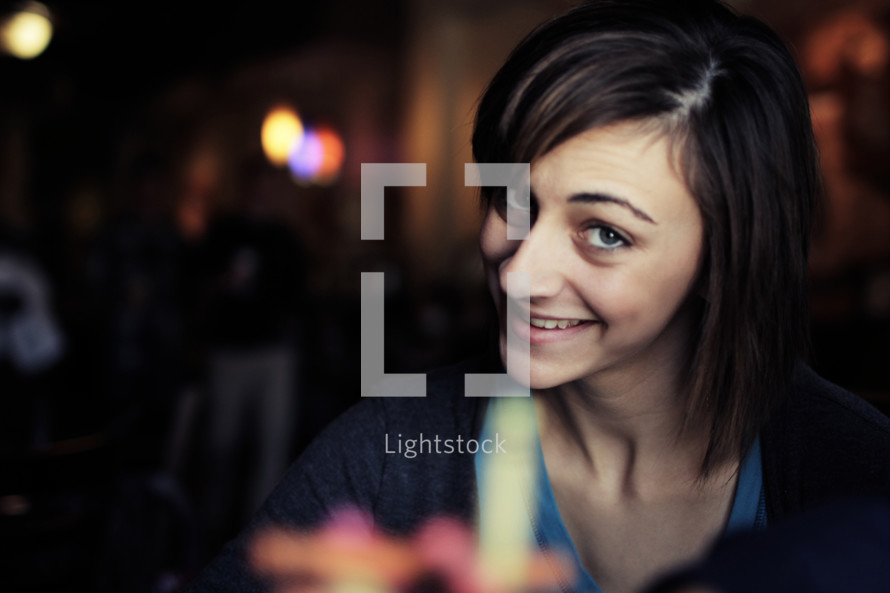 woman in a restaurant smiling