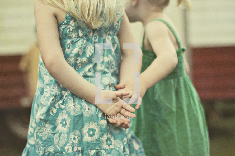 sisters holding hands