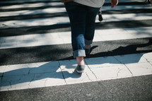 woman crossing a crosswalk 