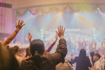 raised hands and group worship 