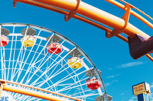 ferris wheel against a blue sky
