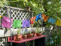 flower pots and banners in a backyard 
