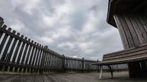 Cloudy day next to a wooden bench on Langeoog island, Germany. Time Lapse