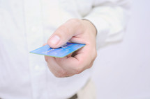 man handing a credit card 