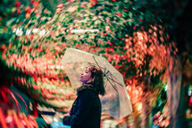 A young woman holding an umbrella 