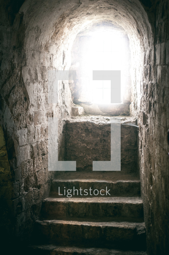 light shining on steps in a tomb 