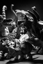 Light shining on dinosaur toys.