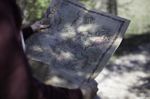 man looking at a world map 