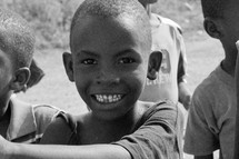 young boys smiling at the camera in Africa 