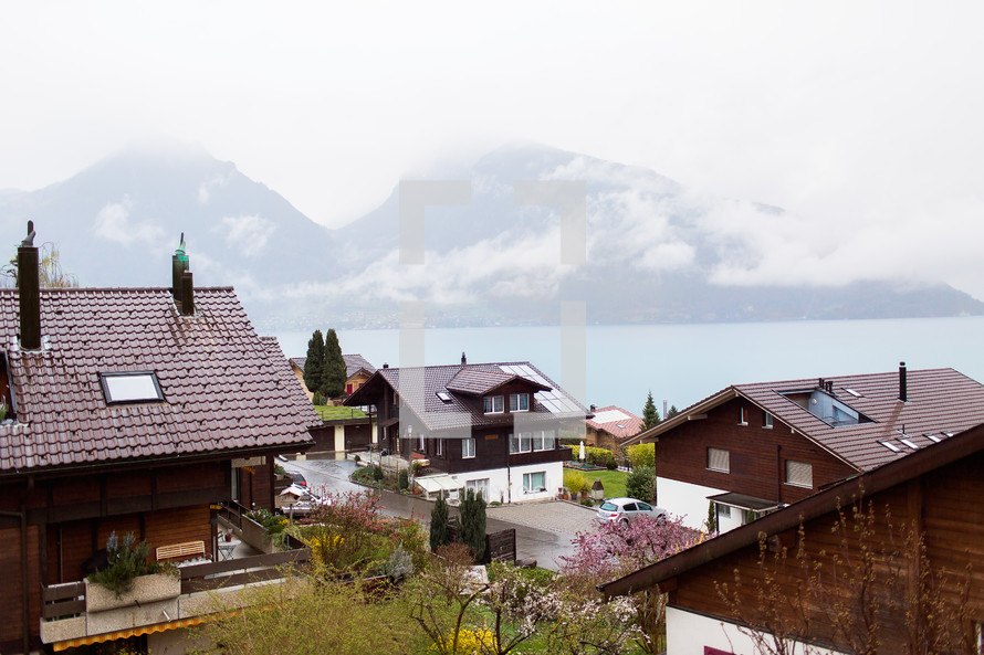 rooftops of homes along a shore in Switzerland 