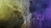 purple and yellow colored nebula underwater swirling and falling down	