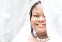 face of an African American bride under her veil 