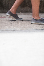 sneakers on a sidewalk 