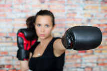 female boxer punching 