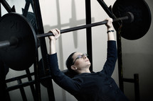 businesswoman lifting weights 
