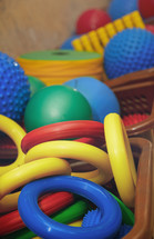 Rubber rings and balls at playground. Close-up photo