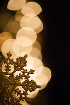 bokeh lights and snowflake ornament 