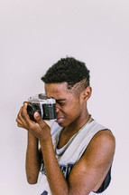 boy holding a camera 