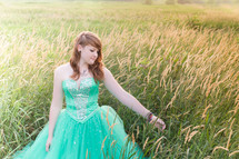 teen girl in a green dress