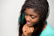 A teen girl in prayer. 